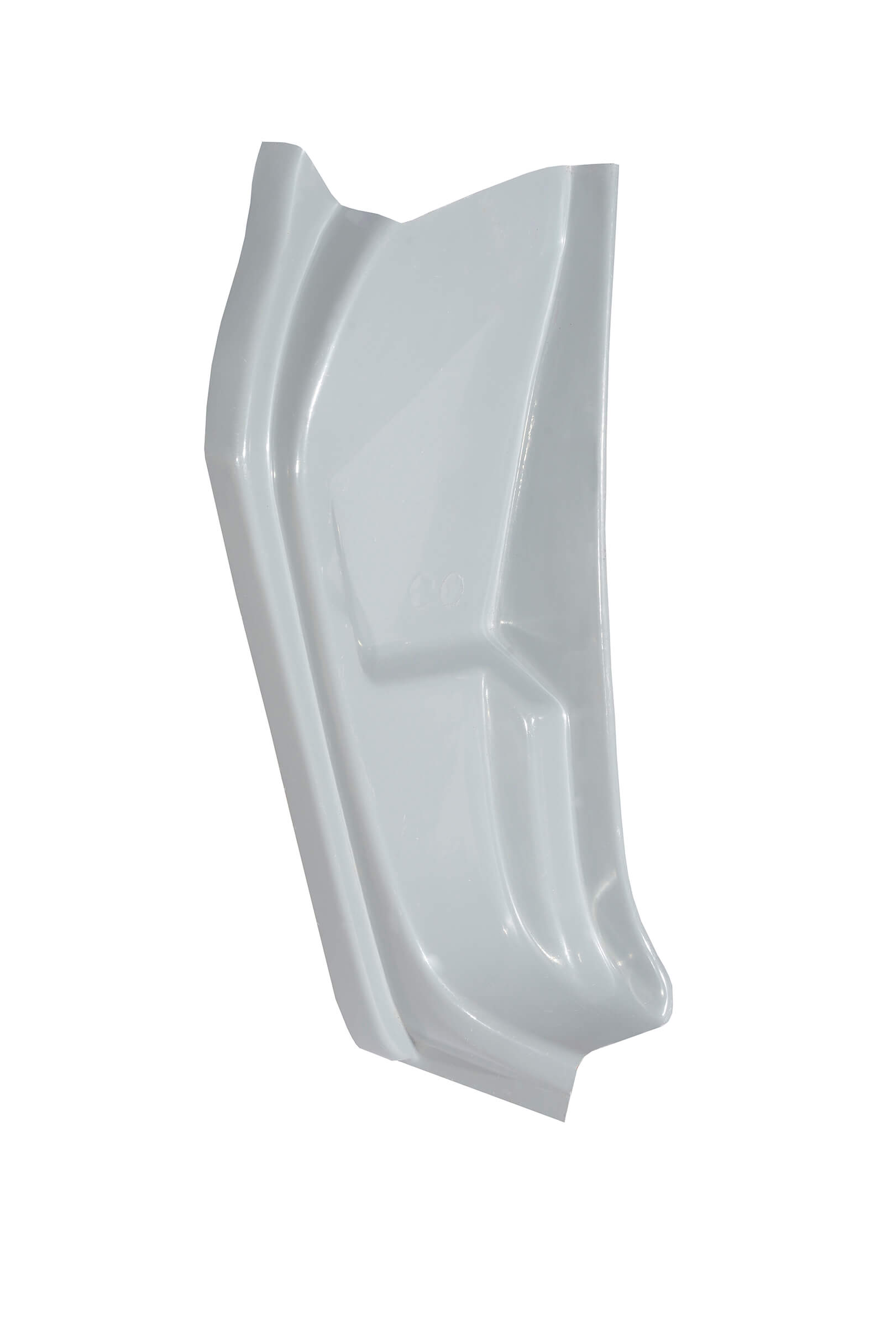 White molded plastic part with angular and curved contours.