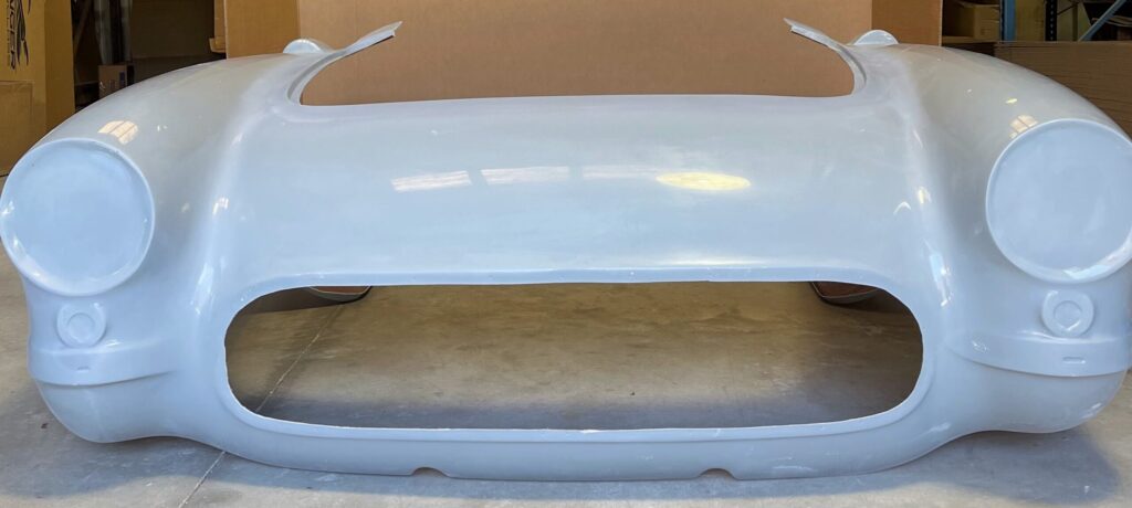 Open car trunk showing empty beige interior.