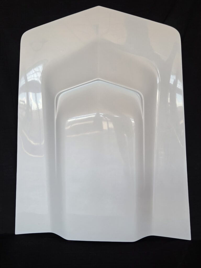 White molded panel on black background