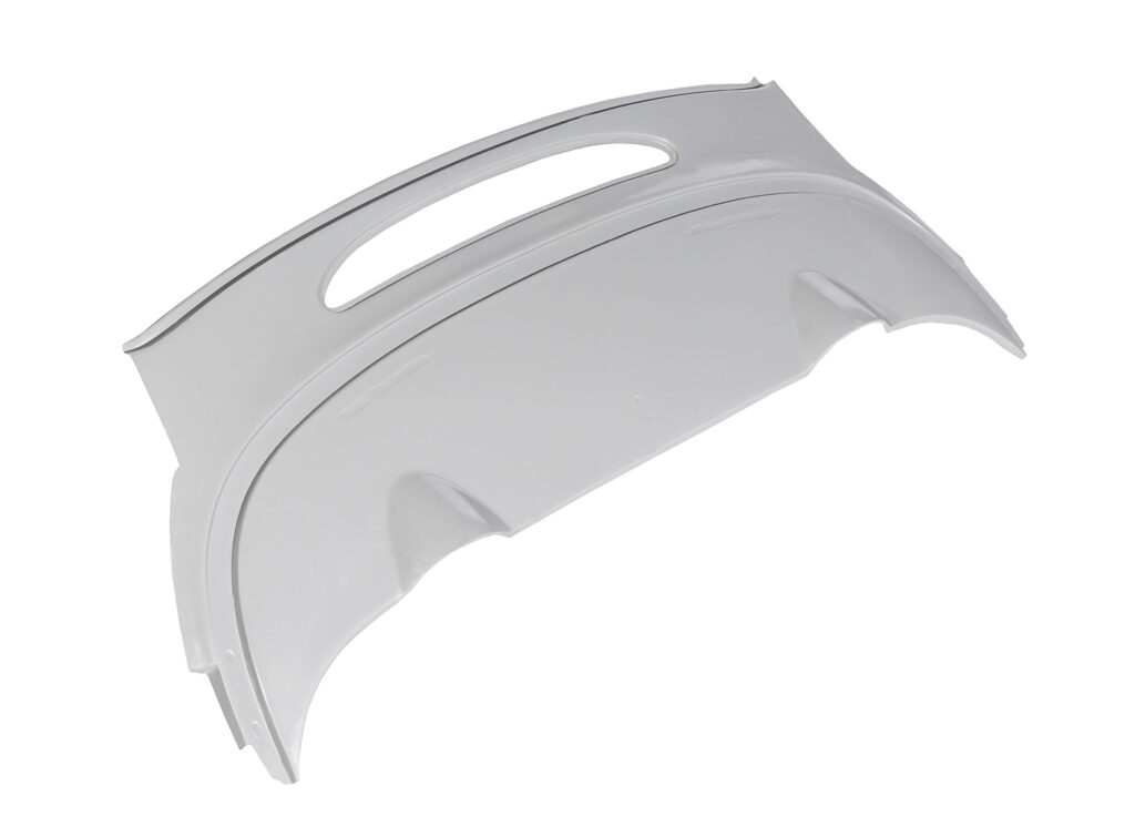 White automotive rear bumper with a handle slot.