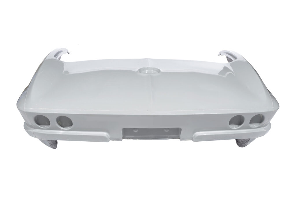 A white car front bumper with fog light openings.