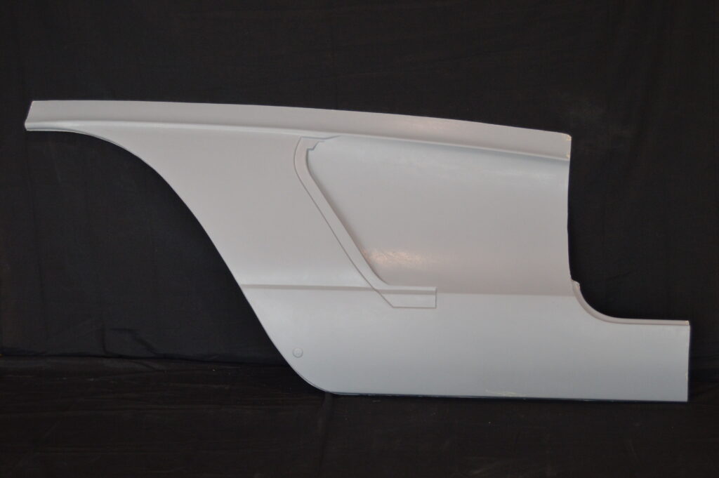 White car quarter panel on black background