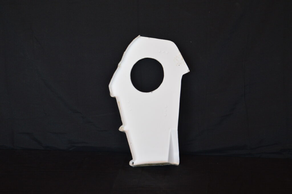 White panel with large oval hole