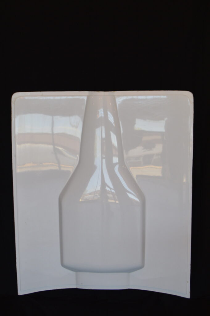 White molded plastic bottle insert tray