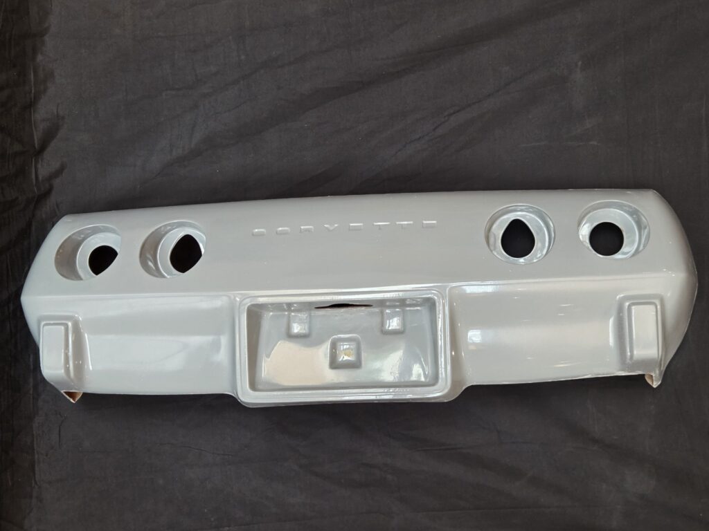 Gray Corvette rear valance with four round outlets