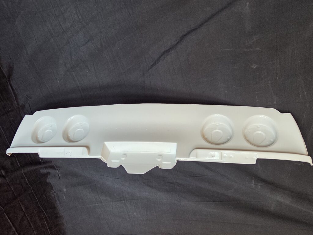 White painted rear light panel with four cups