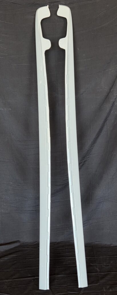 Pair of long gray plastic trim rails