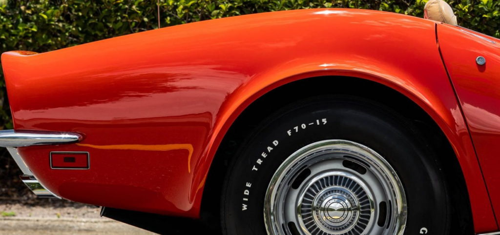 Red classic car rear wheel close-up
